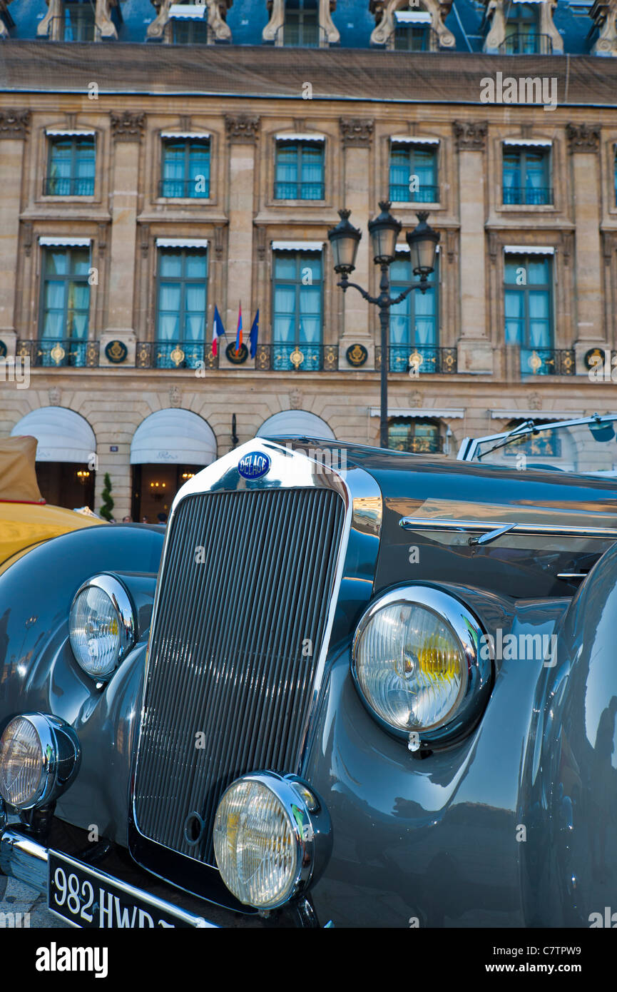 Paris, France, Antique Cars, on Place Vendome, in front of the Ritz Hotel. expensive vintage