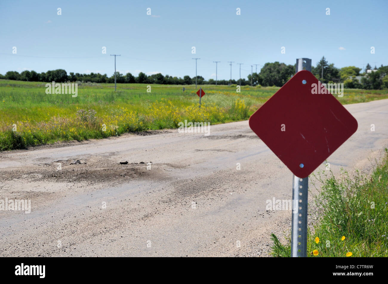 Rough road signs along bumpy roads in rural Saskatchewan, Canada. Stock Photo