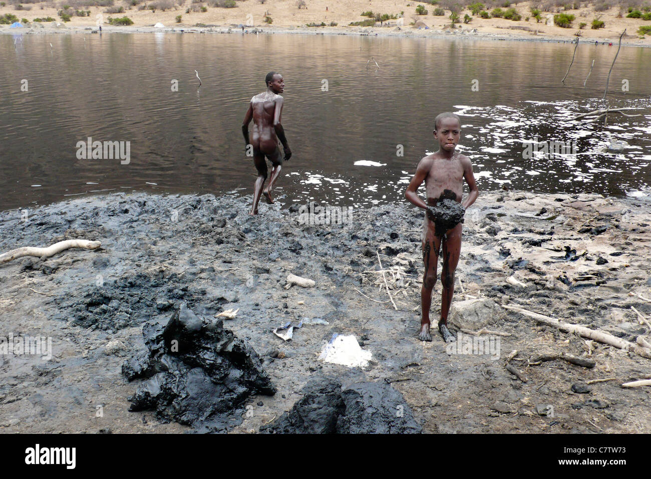 Ethiopia, South Omo Valley, el Sod crater lake, children at work Stock Photo