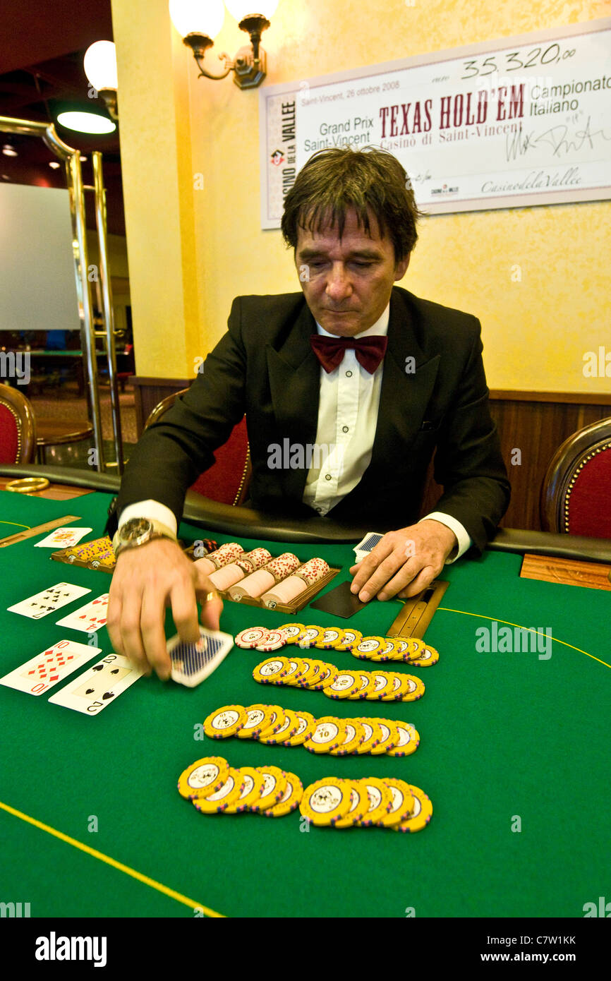 Italy, Val D'Aosta, Saint Vincent, croupier at poker table Stock Photo -  Alamy