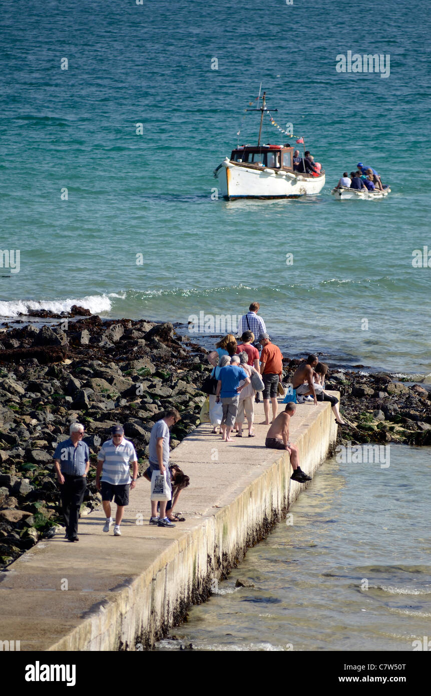 Tourists waiting for boat trip St. Ives Cornwall UK Stock Photo
