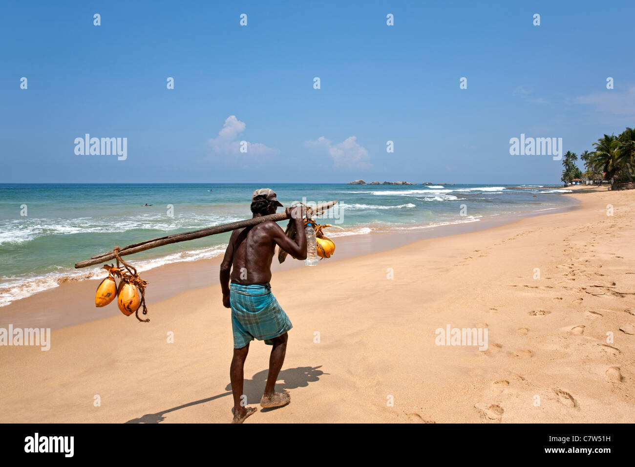 Coconuts seller. Hikkaduwa beach. Sri Lanka Stock Photo