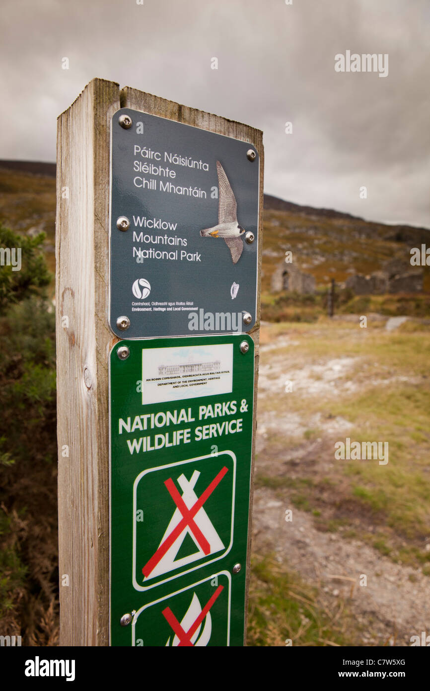 Ireland, Co Wicklow, Wicklow Mountains national park sign at old ruined granite worker’s house Stock Photo