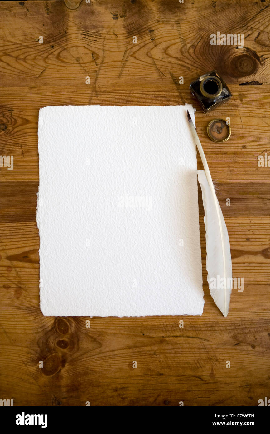 A Blank Sheet Of Hand Made Paper With Quill Pen And Ink Bottle Ready To Receive Type In Copy Space Stock Photo Alamy