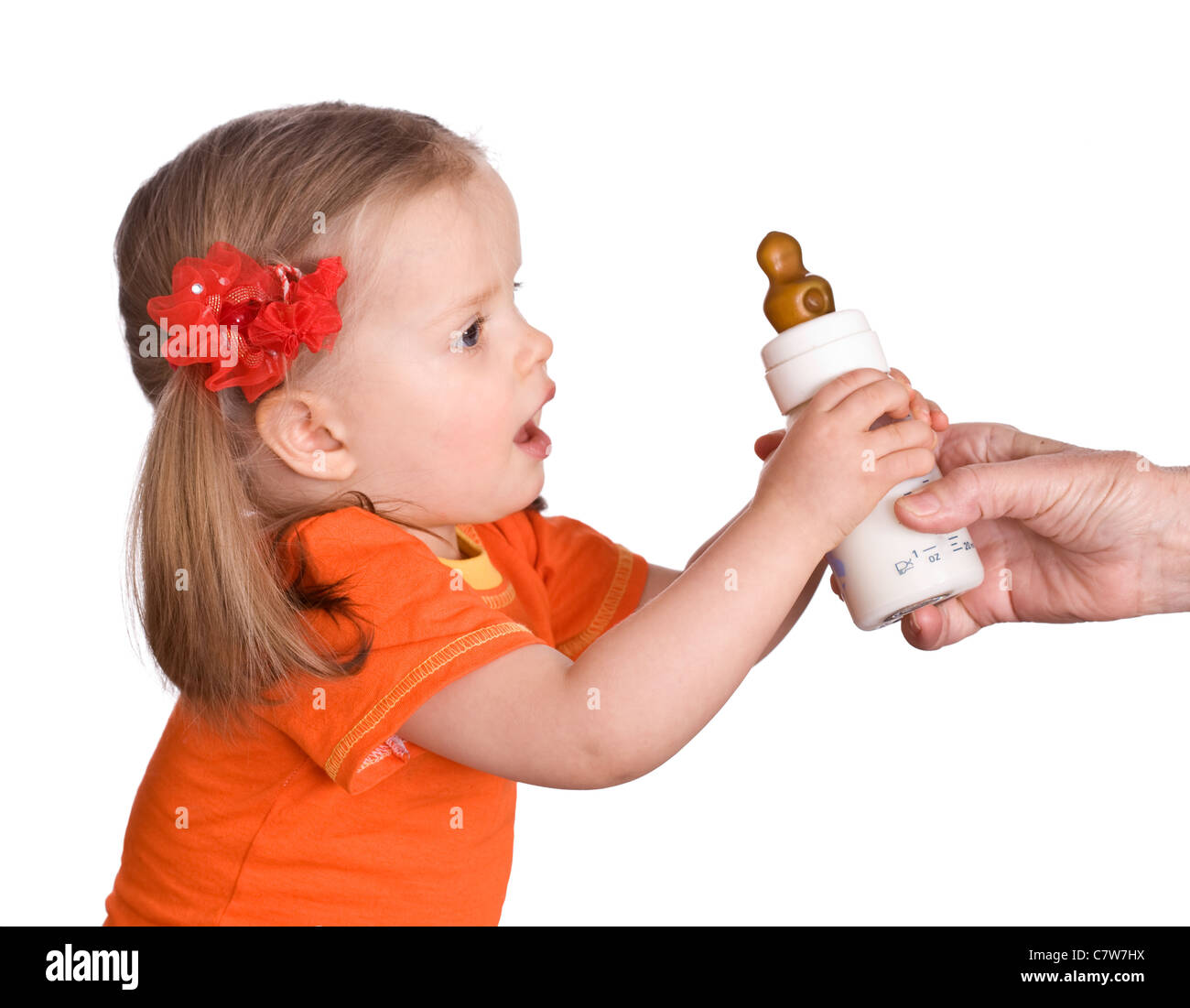 Child take baby bottle with milk and pacifier Stock Photo Alamy