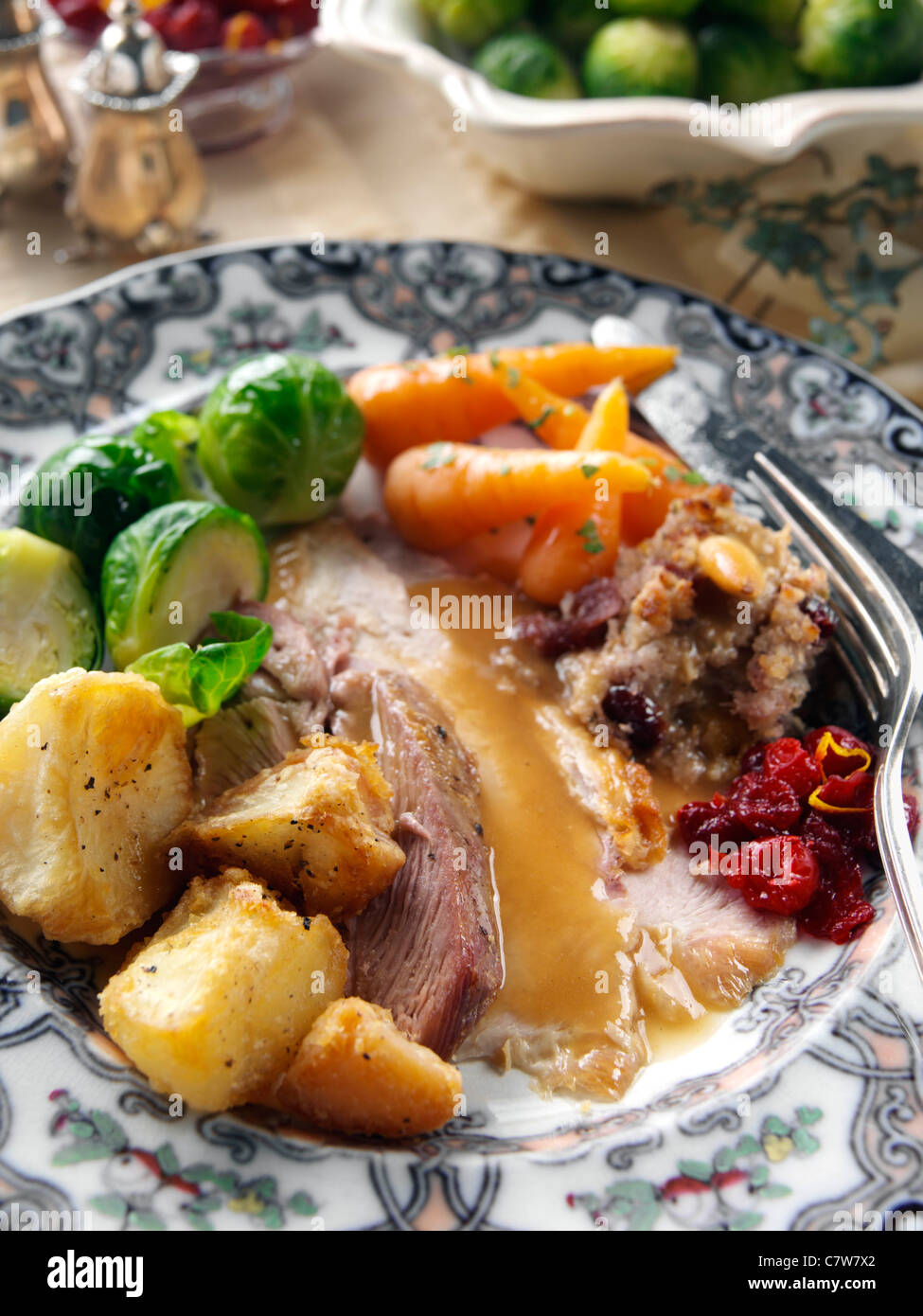 Roast turkey slices with stuffing Brussels sprouts baby carrots roast