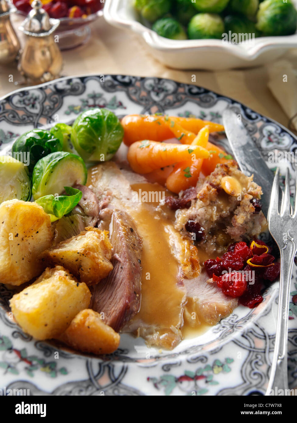 Roast turkey slices with stuffing Brussels sprouts baby carrots roast