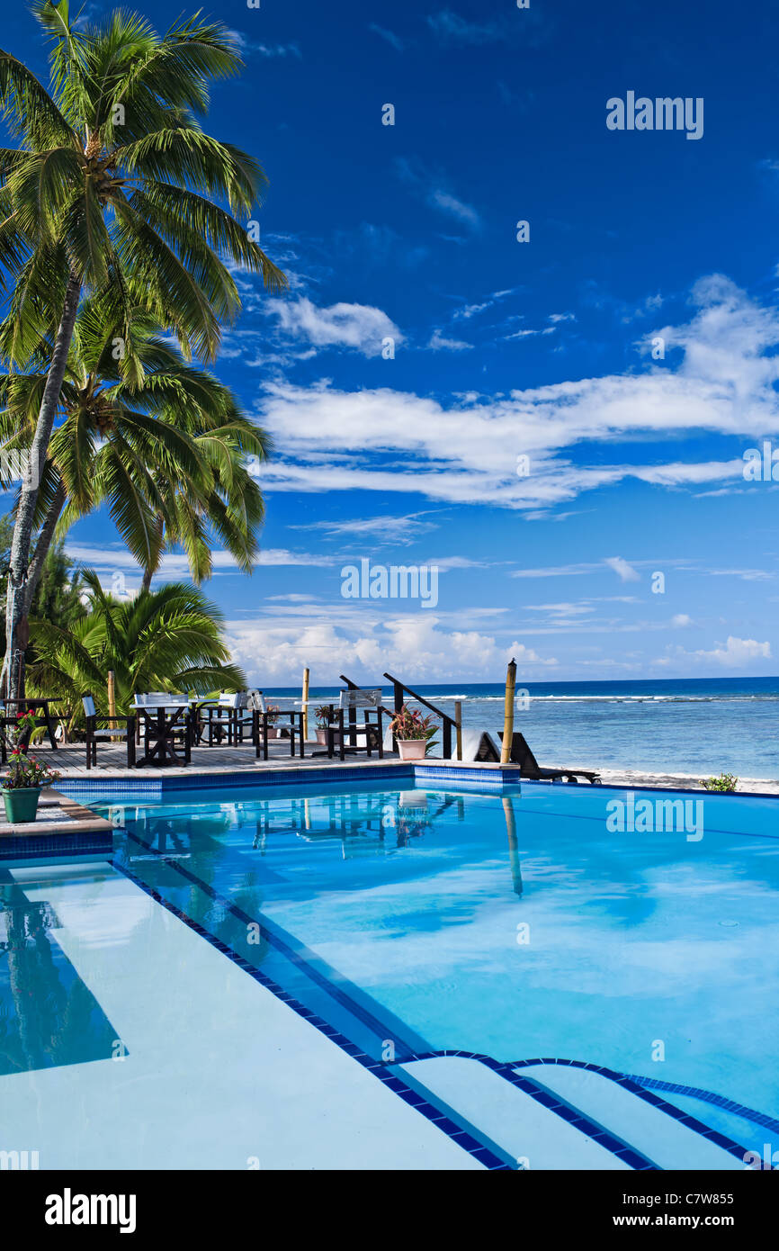 Infinite swimming pool in a tropical beach resort Stock Photo