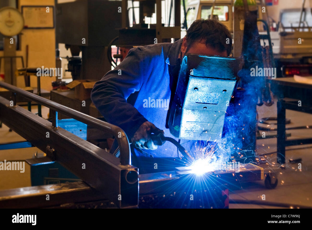 Metal-worker grinding Stock Photo