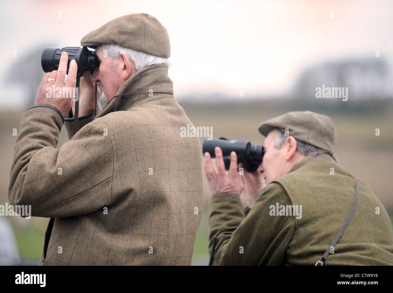 Two racegoers watch the action from the back of their estate car at the Duke of Beaufort's Hunt Point-to-Point 2009, Gloucesters Stock Photo