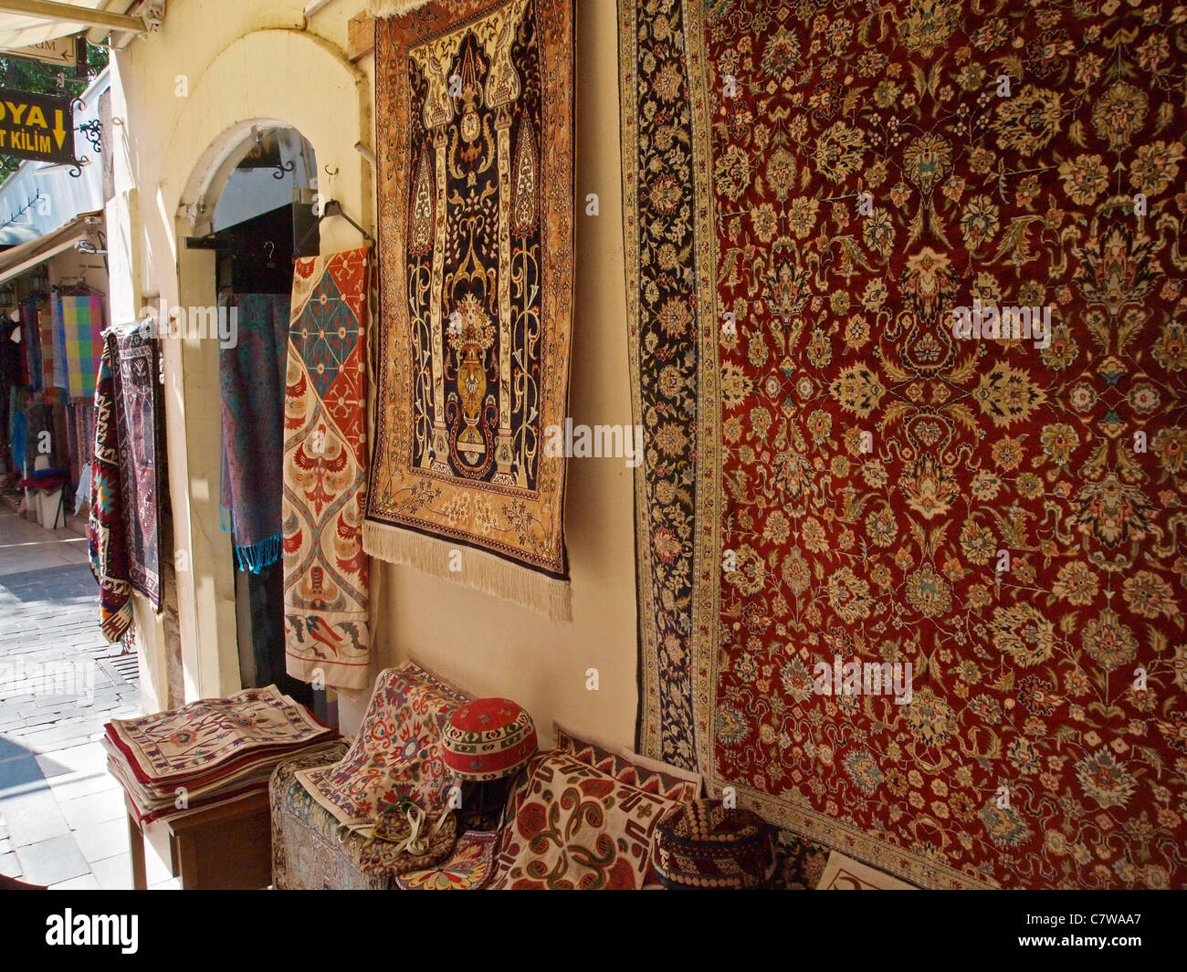 TURKISH CARPETS HANGING ON WALL AND FOR SALE IN OLD TOWN ANTALYA TURKEY