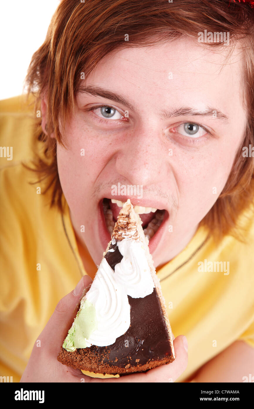 Face of man eating cake. Stock Photo