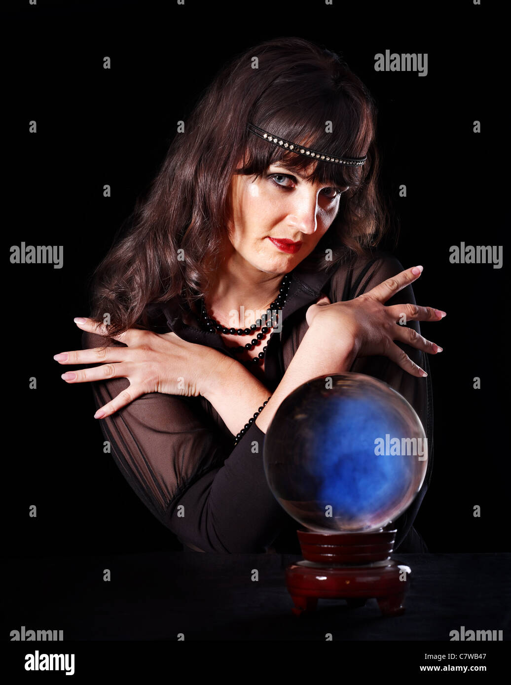 Young woman with crystal ball. Beauty and fashion Stock Photo - Alamy