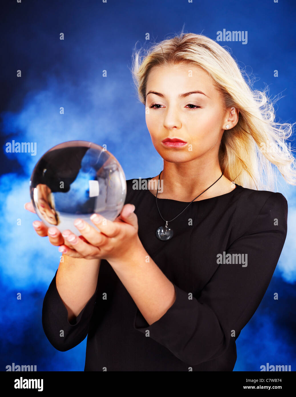 Young woman with crystal ball Stock Photo Alamy
