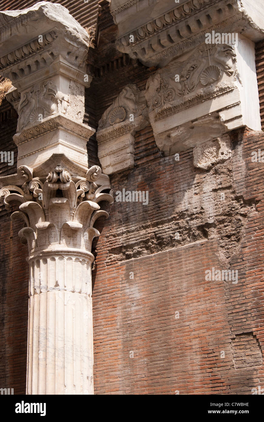 Detail rear upper brick exterior wall of Pantheon in Rome with corinthian column and remains of marble frieze. Stock Photo