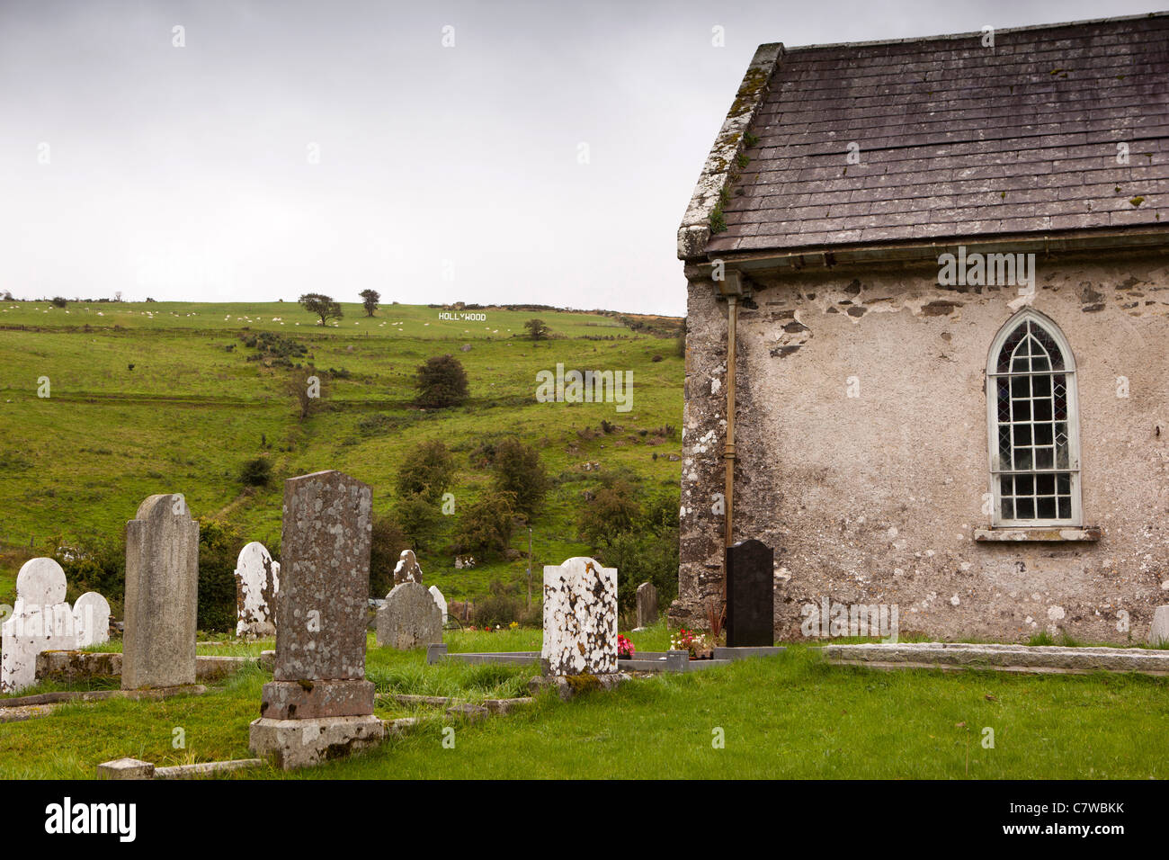 Ireland, Co Wicklow, Hollywood, white painted wooden village sign on