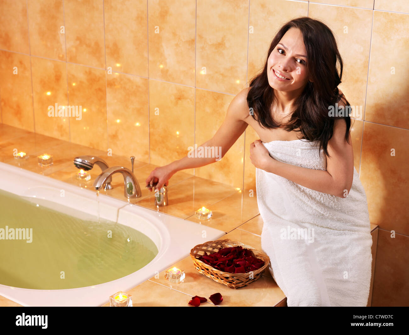 Woman relaxing in bath with rose petal Stock Photo Alamy
