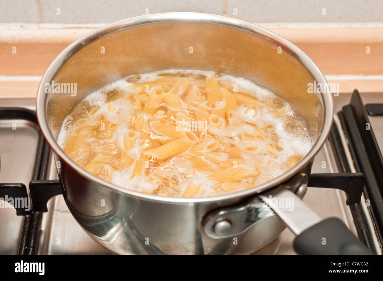 Pasta boiling in a pan Stock Photo - Alamy
