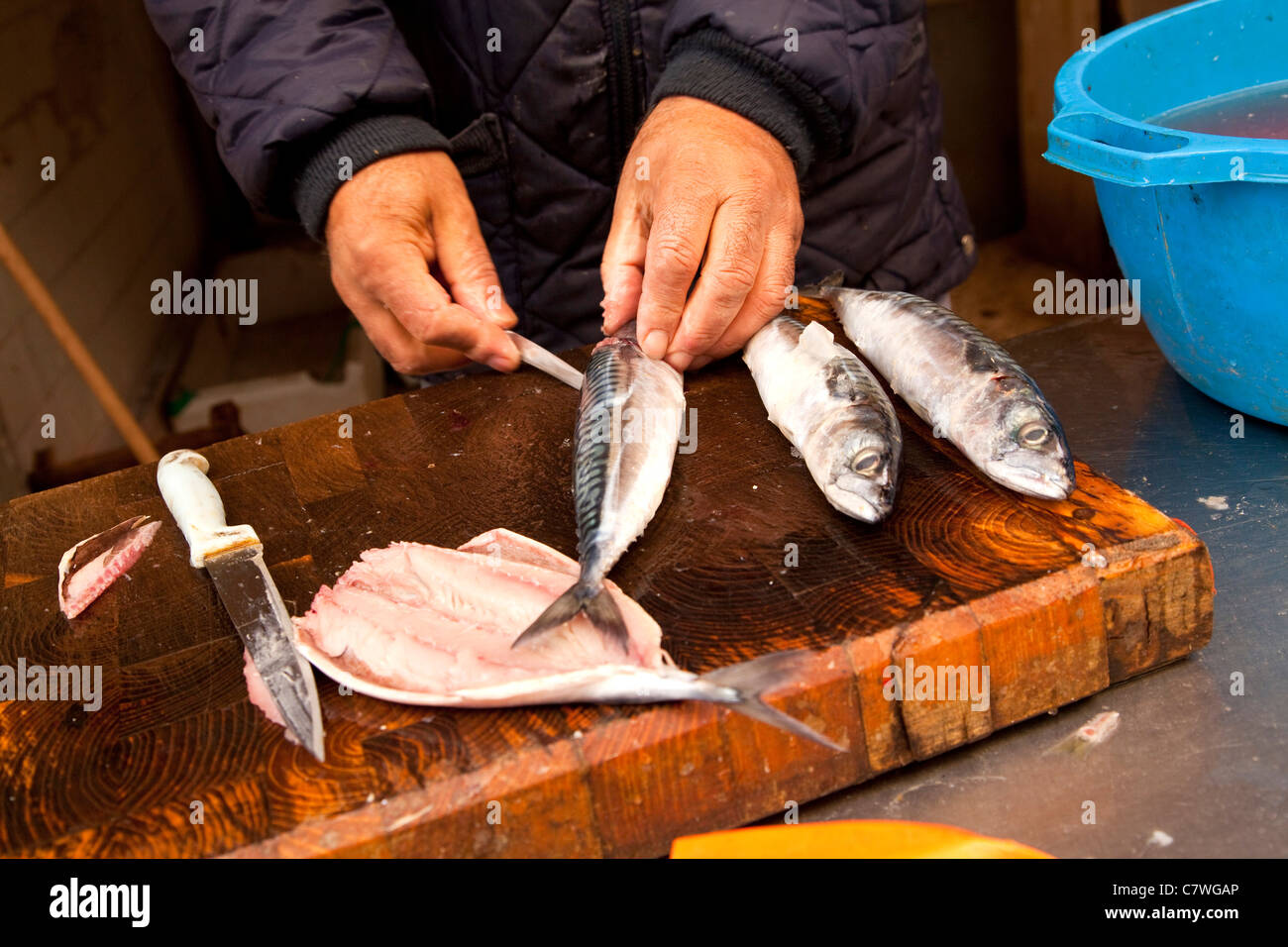 Old man cleaning fish knife hi-res stock photography and images - Alamy