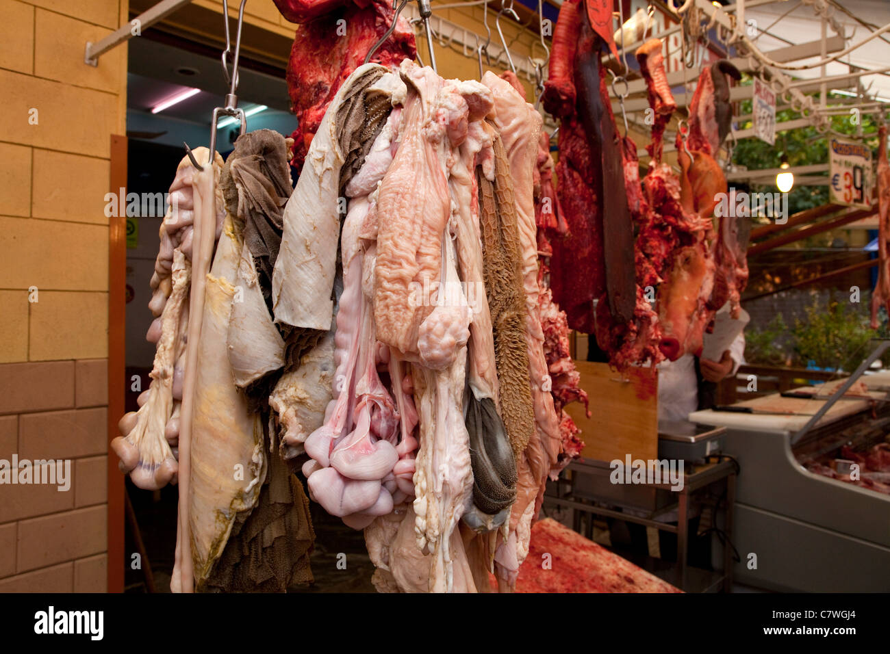 Butcher's shop selling raw meat and guts at Ballarò, traditional old market in Palermo, Sicily, Sicilia, Italy Stock Photo