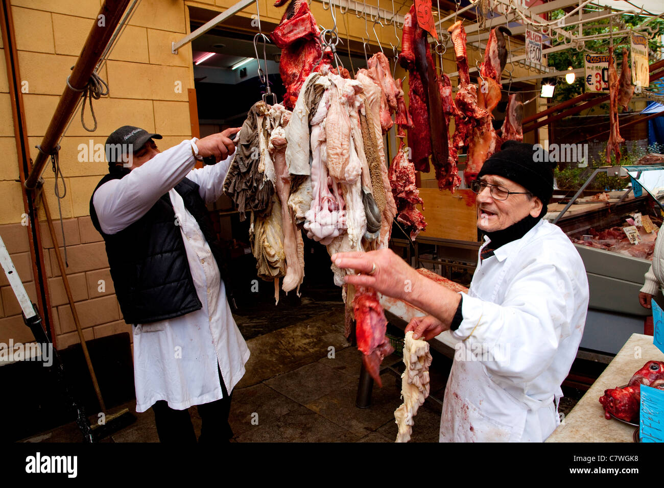 Butcher's shop selling raw meat and guts at Ballarò, traditional old market in Palermo, Sicily, Sicilia, Italy Stock Photo
