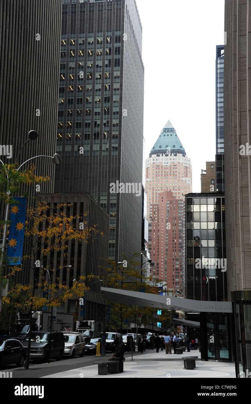 Autumn trees, Time Life Building, skyscrapers, parked cars, business people, West 50th Street, towards One World Plaza, New York Stock Photo
