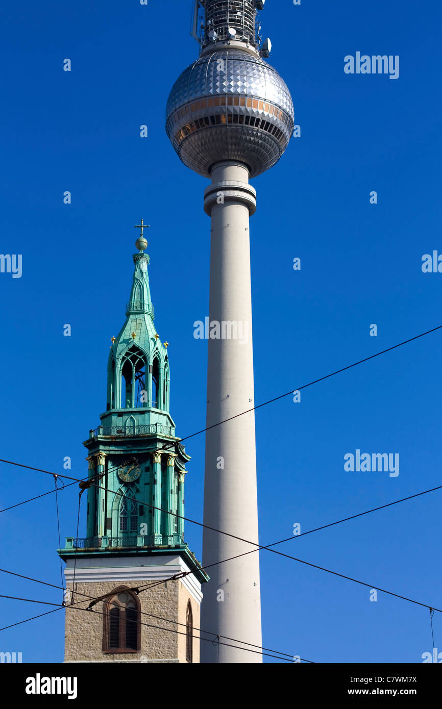 Image of the Berlin St. Mary's Church and TV Tower with blue sky in October 2010. Stock Photo