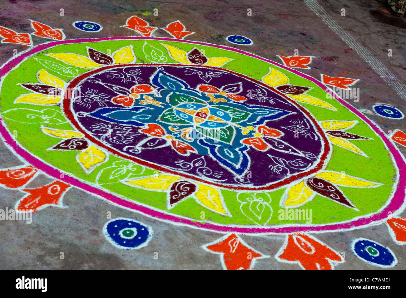 Rangoli design on an Indian street outside a hindu temple during the ...