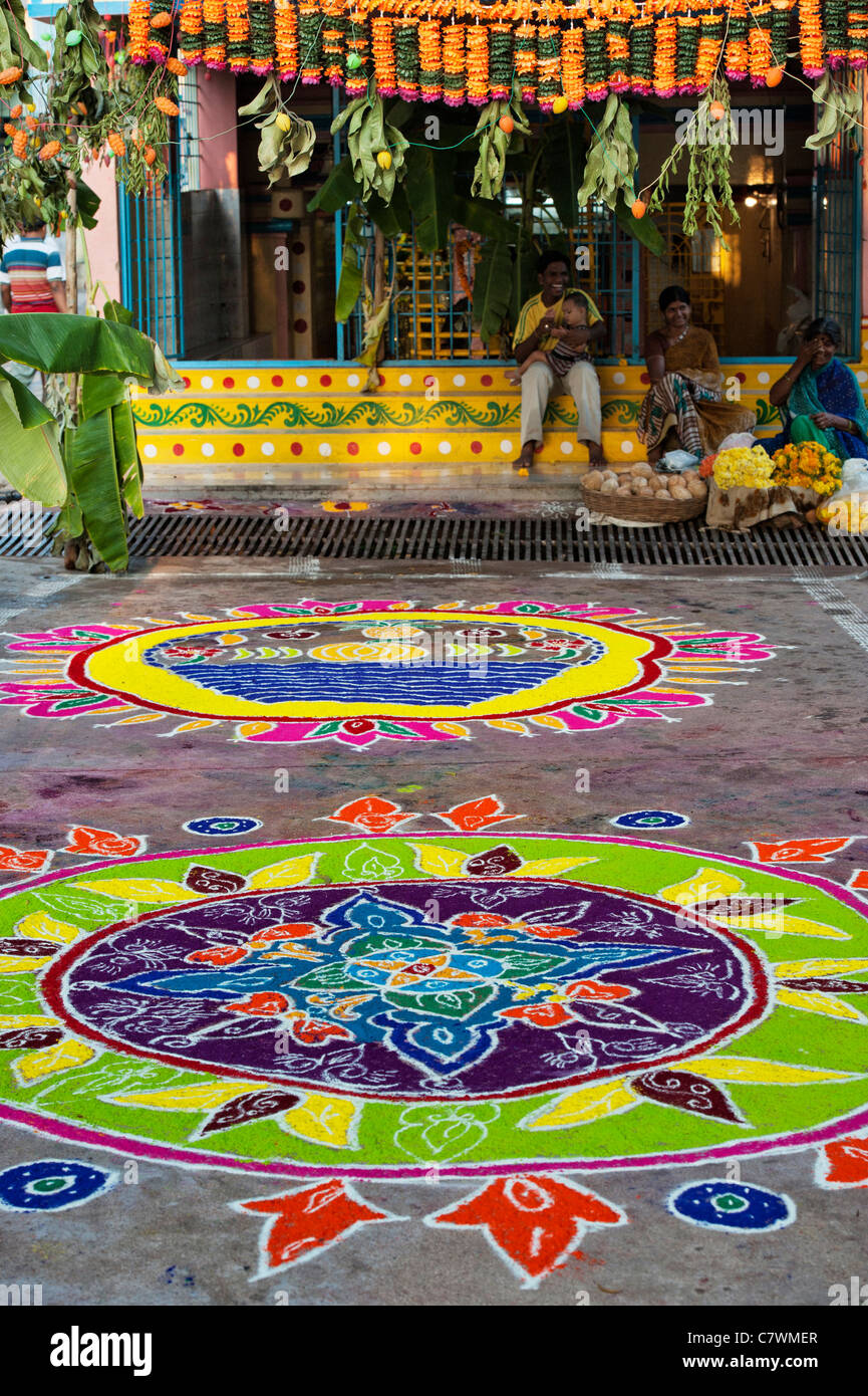 Rangoli design on an Indian street outside a hindu temple during the festival of Dasara. Puttaparthi, Andhra Pradesh, India Stock Photo