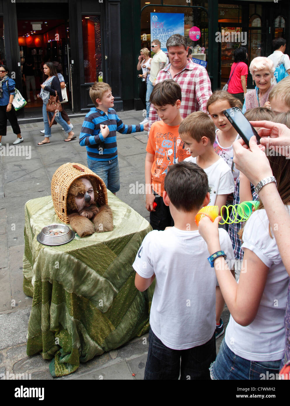 A street entertainer performing in Covent Garden, London, England, U.K. Stock Photo