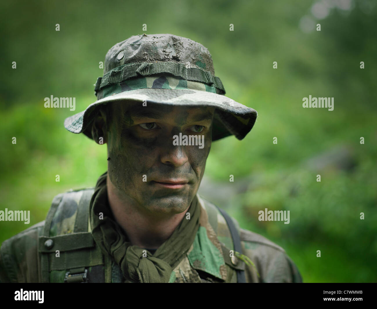 Head and shoulders view of a U.S. Special Forces soldier with camouflage face paint. Stock Photo