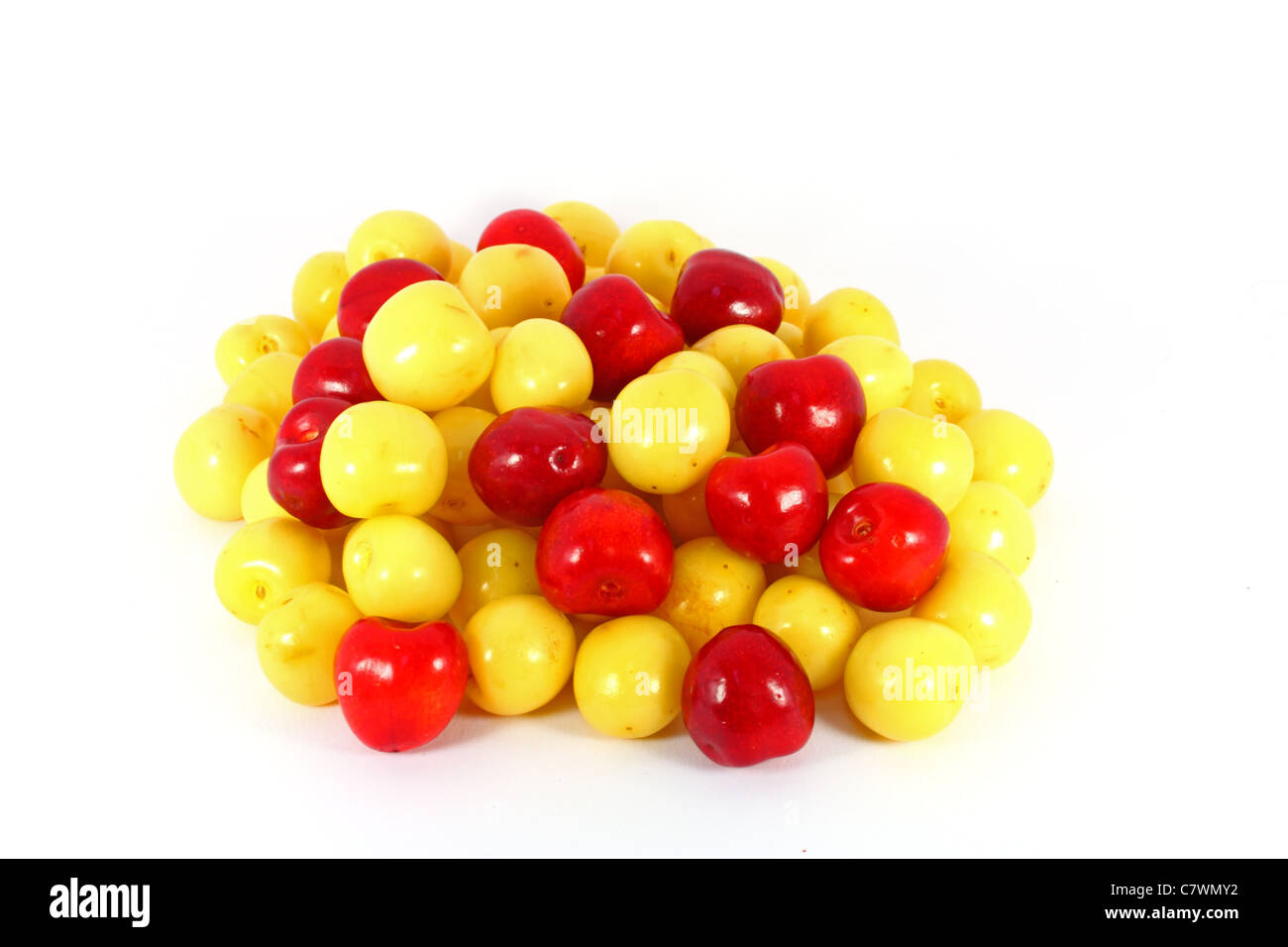 Red and yellow cherries isolated on white Stock Photo - Alamy