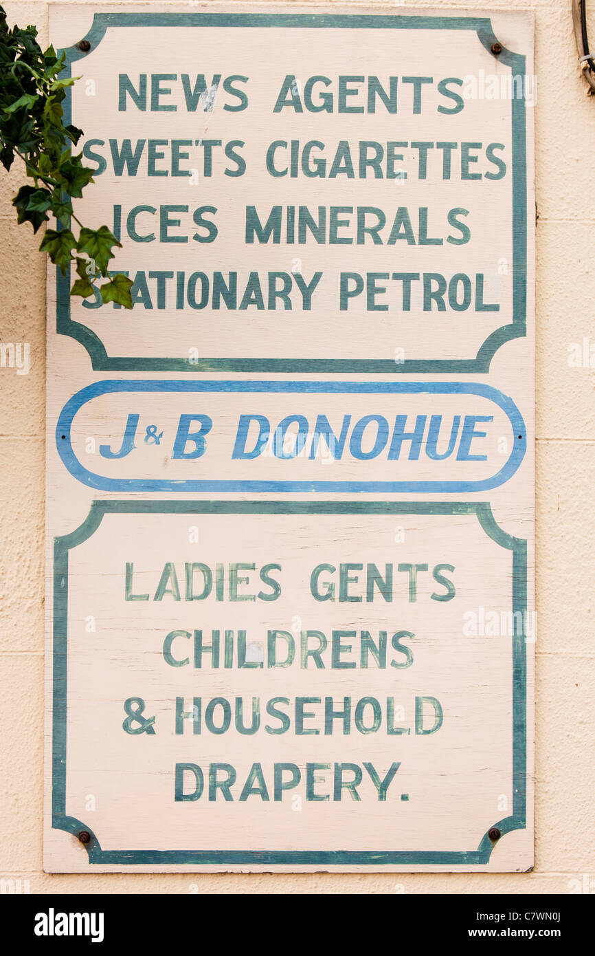 Ir768 Ireland, Co Wicklow, Tinahely, Dwyer Square, sign of Donohue’s store selling everything from petrol to clothes Stock Photo