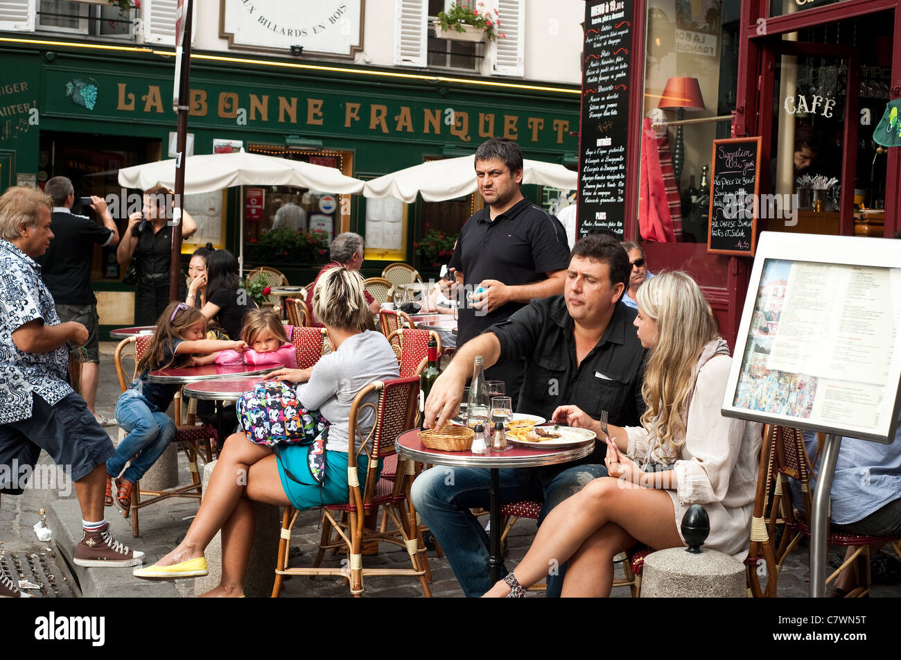 Paris, France - Eating ouiside at Restaurant 'Le Consulat' in Montmartre Stock Photo