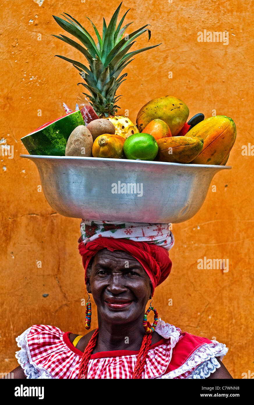 Unidentified Palenquera woman sell fruits in Cartagena, Colombia on December 21 2010, Palenqueras are a unique African descendan Stock Photo