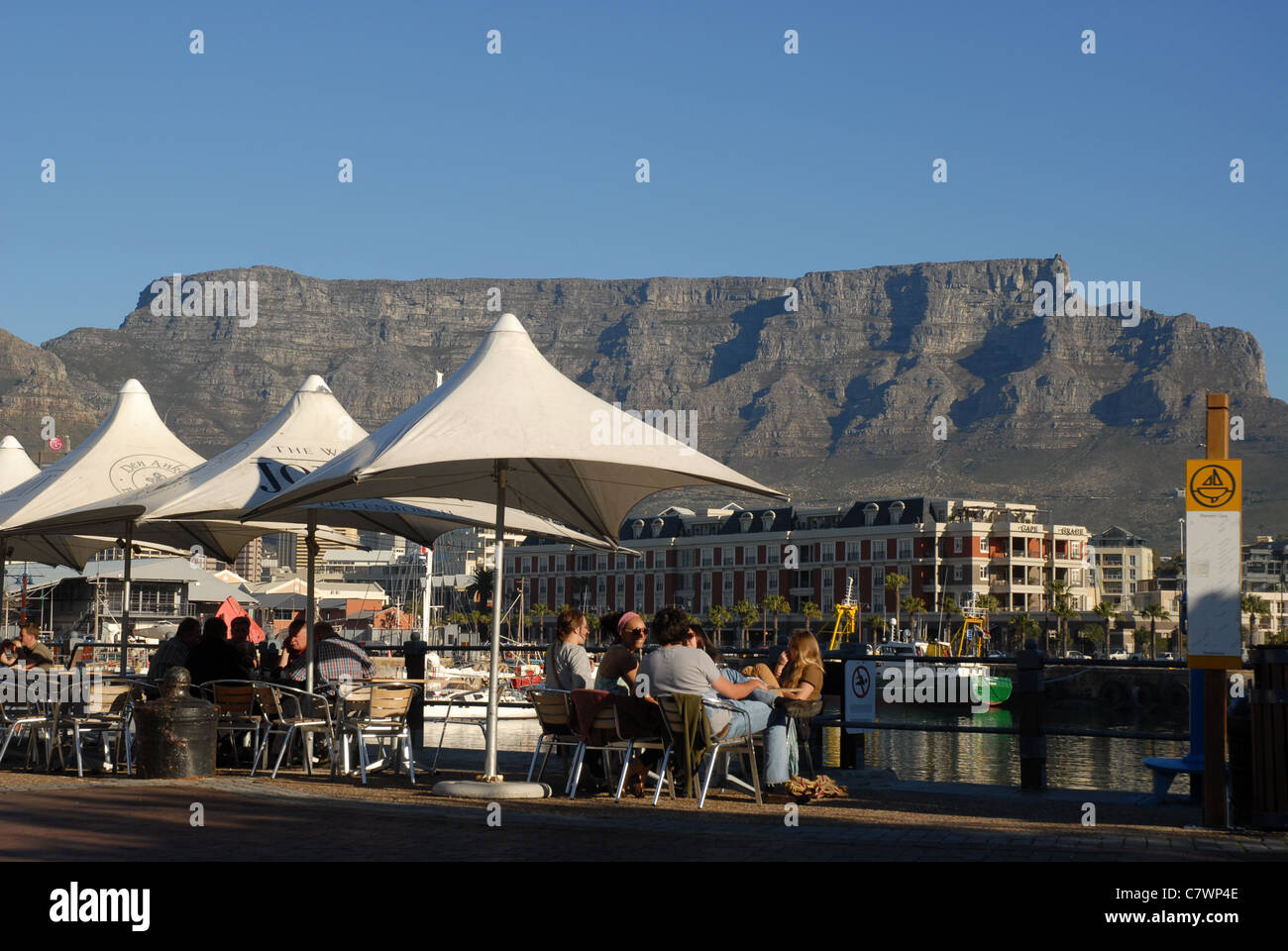 cafe scene with Table Mountain beyond, The Waterfront, Cape Town, Western Cape, South Africa Stock Photo