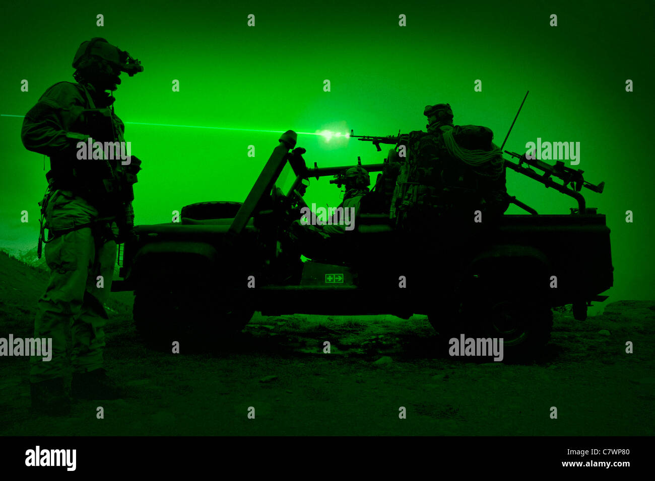 Night vision view of U.S. Special Forces on patrol in a special operation vehicle. Stock Photo