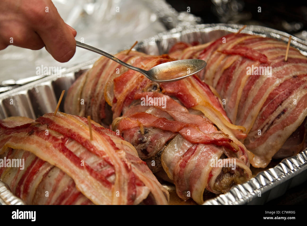 Bacon turkey basting while baking in oven, gourmet food Stock Photo