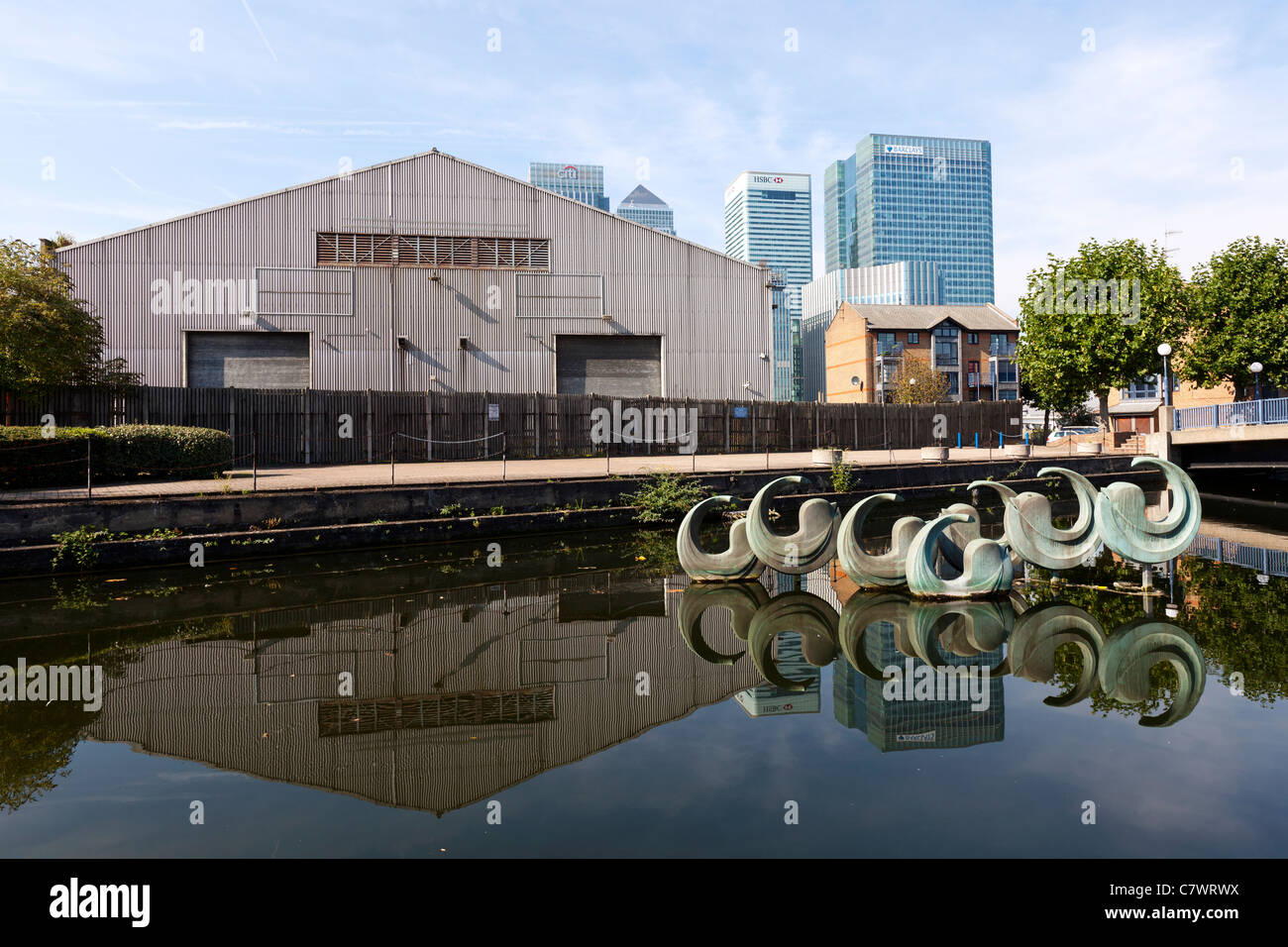 The Leap by Franta Belsky depicts eight dolphins, Blackwall Basin, Manchester Road, Isle of Dogs, London, England, UK. Stock Photo