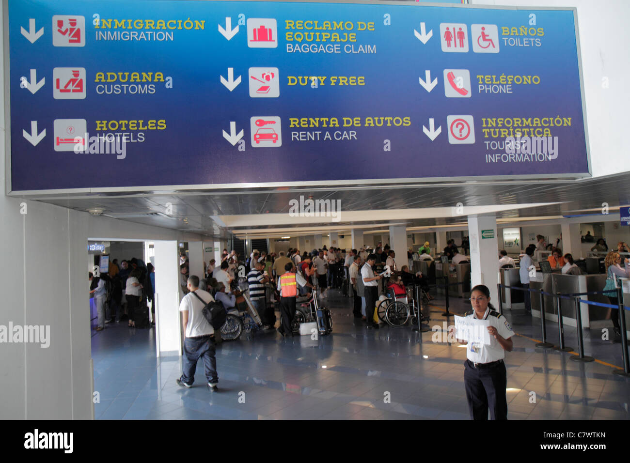 Managua Nicaragua,Augusto C. Sandino International Airport,MGA,aviation,ticket counter,Hispanic woman female women adult adults,passenger escort,sign, Stock Photo