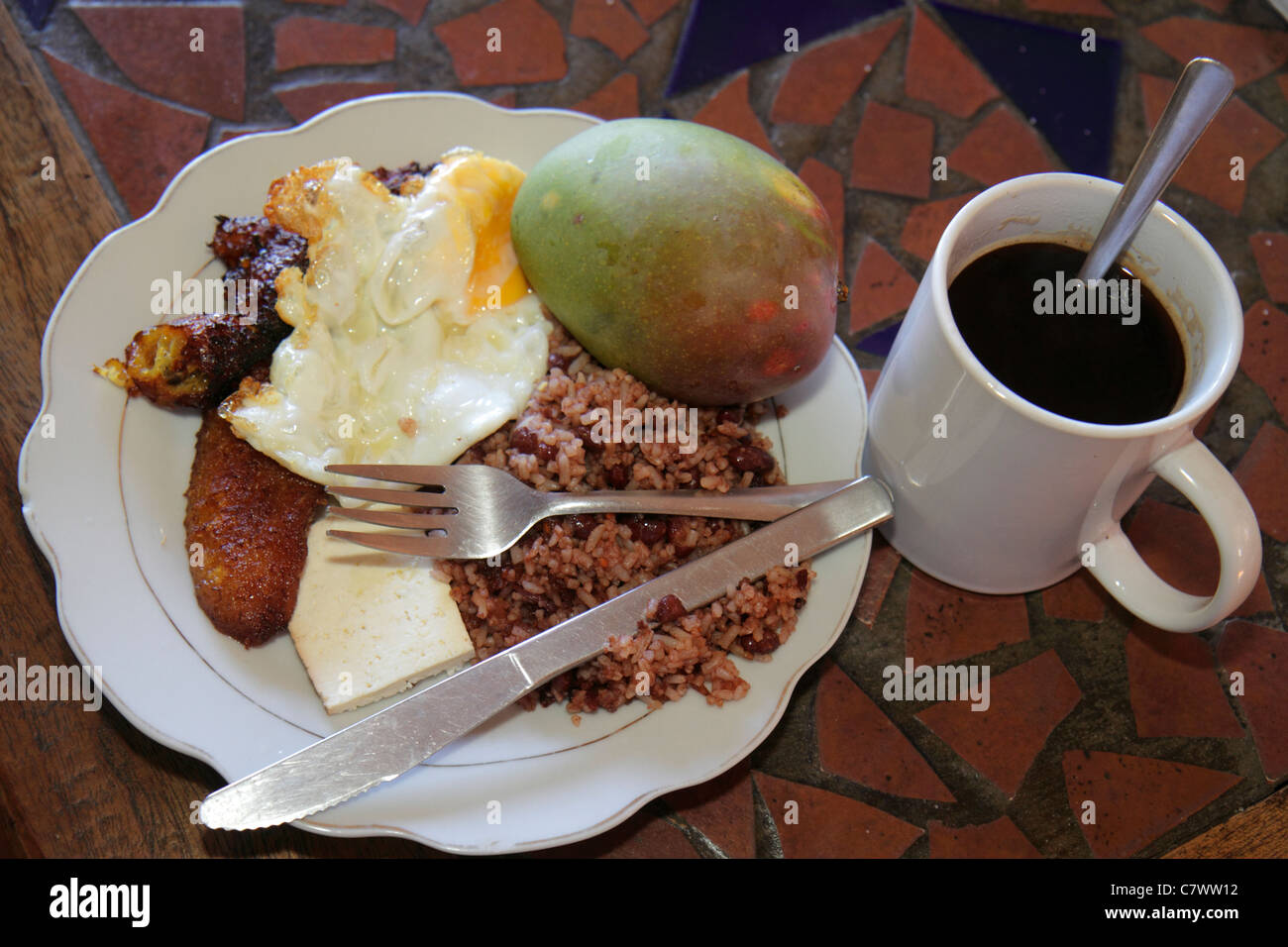 Managua Nicaragua,Bolonia,Hotel Villa Angelo,typical breakfast,food,plate,dish,egg,gallo pinto,rice,beans,coffee,barista,fried plantain,cheese,utensil Stock Photo