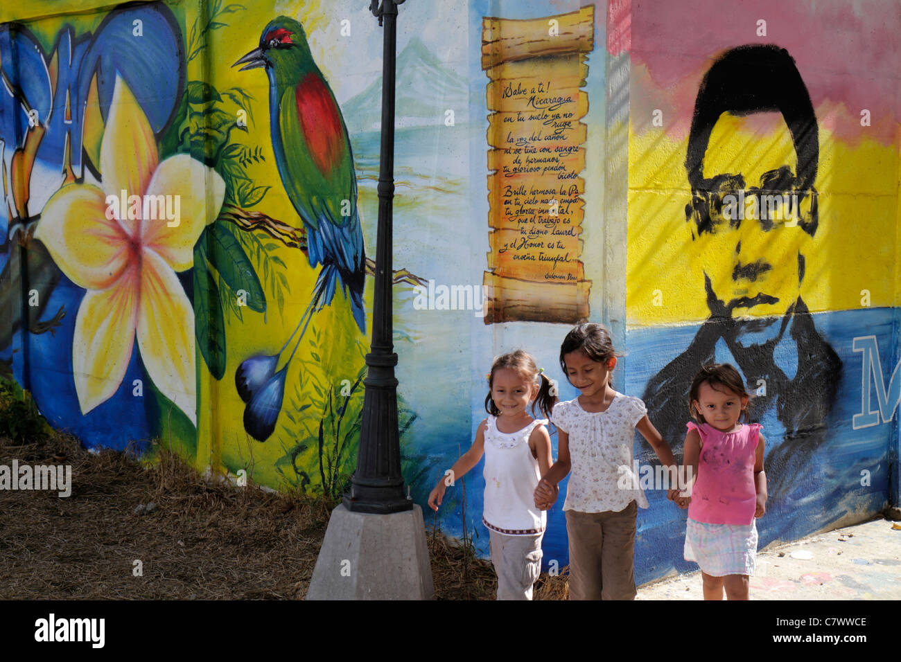 Managua Nicaragua,Calle Colon,public art,mural,colorful,bird,flower,person,Hispanic girl girls,youngster,female kids children child,younger,older,sibl Stock Photo