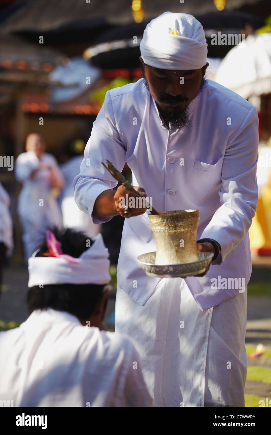 Priest giving blessing at temple ceremony, Bali, Indonesia Stock Photo ...