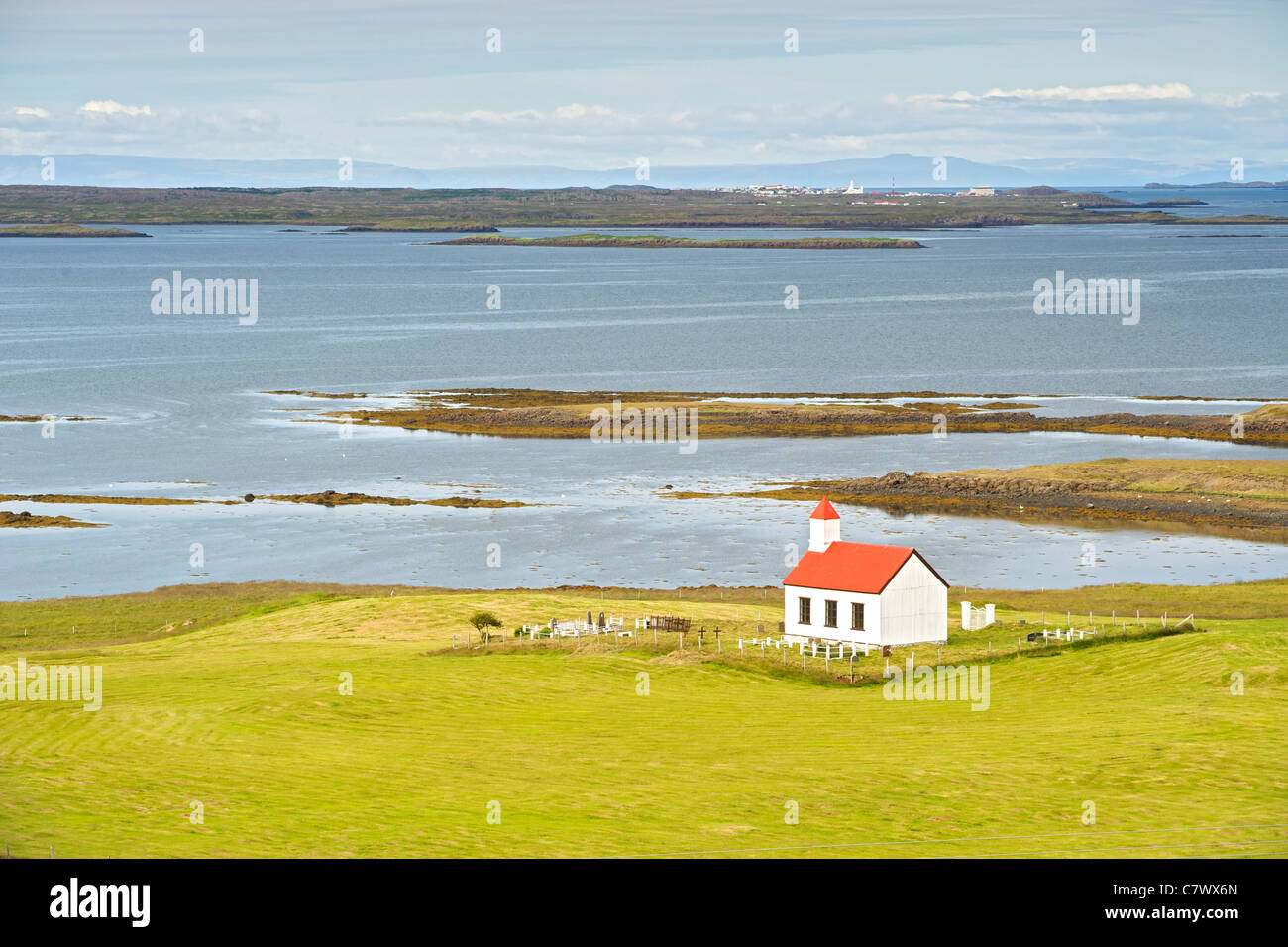 Flatey church and the landscape of Breidafjordur in west Iceland. Stock Photo