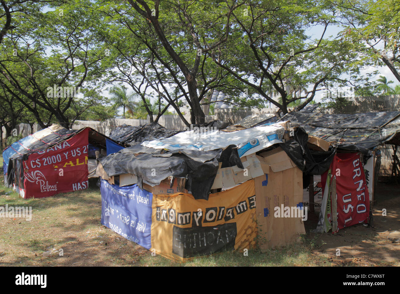 Managua Nicaragua,Avenida Simon Bolivar,protest,squatters,cardboard house,huts,shacks,corporate social responsibility,Grupo Pellas,sugar producer,expo Stock Photo