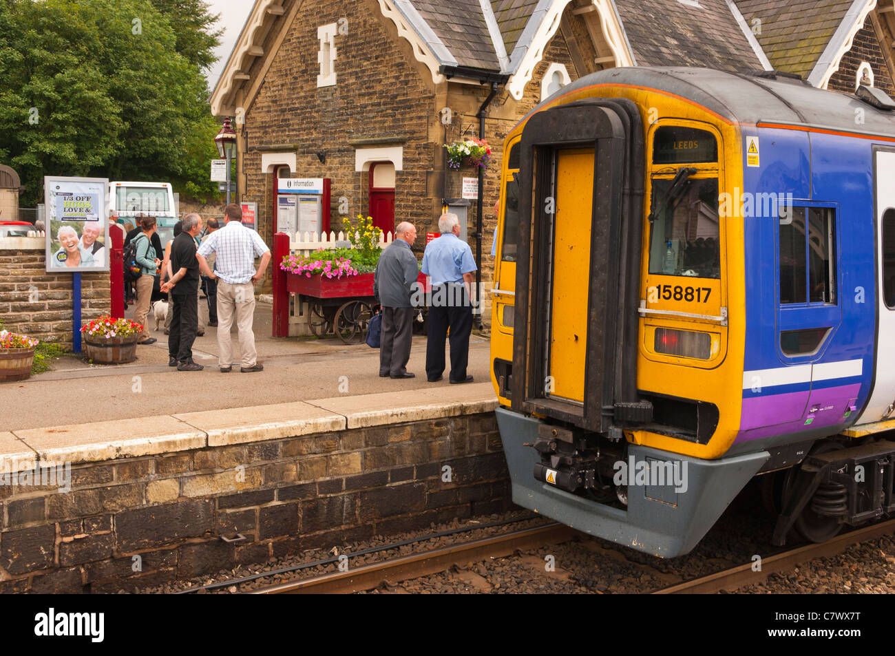 A train arrives at the Railway Station at Settle in North Yorkshire , England , Britain , Uk Stock Photo