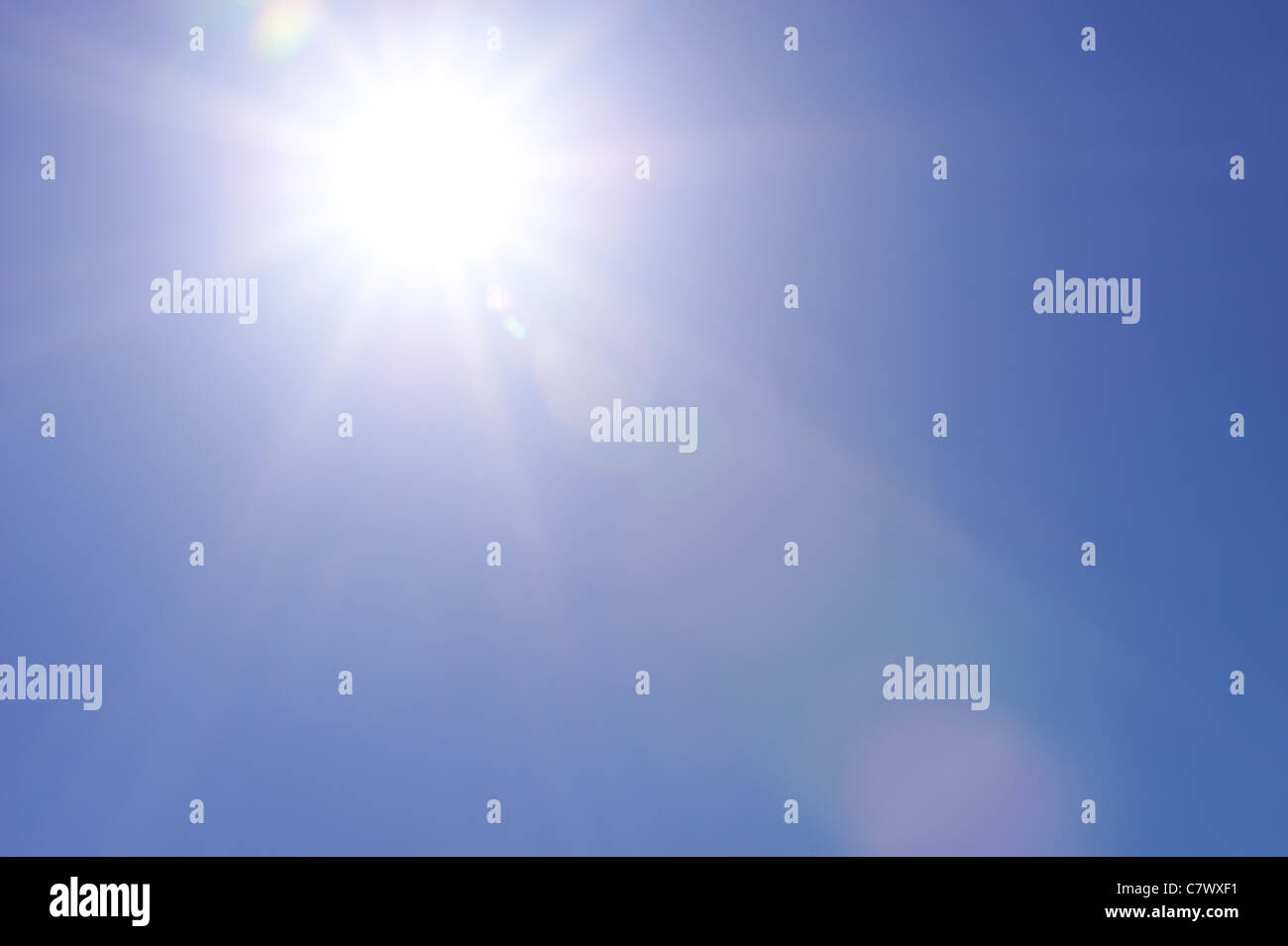 Clear blue sky and sunburst Stock Photo
