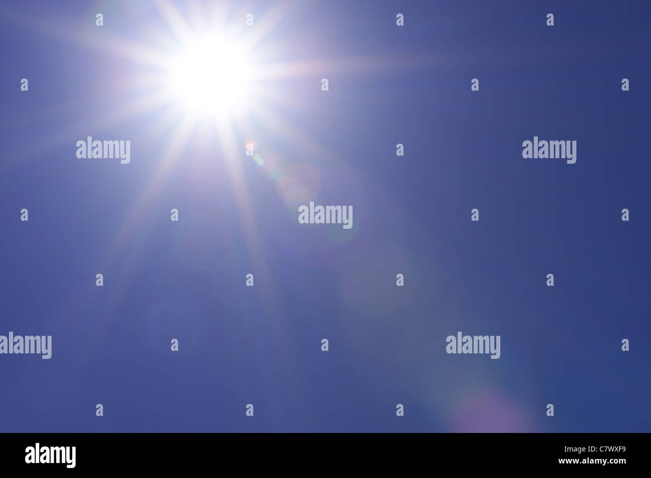 Clear blue sky and sunburst Stock Photo