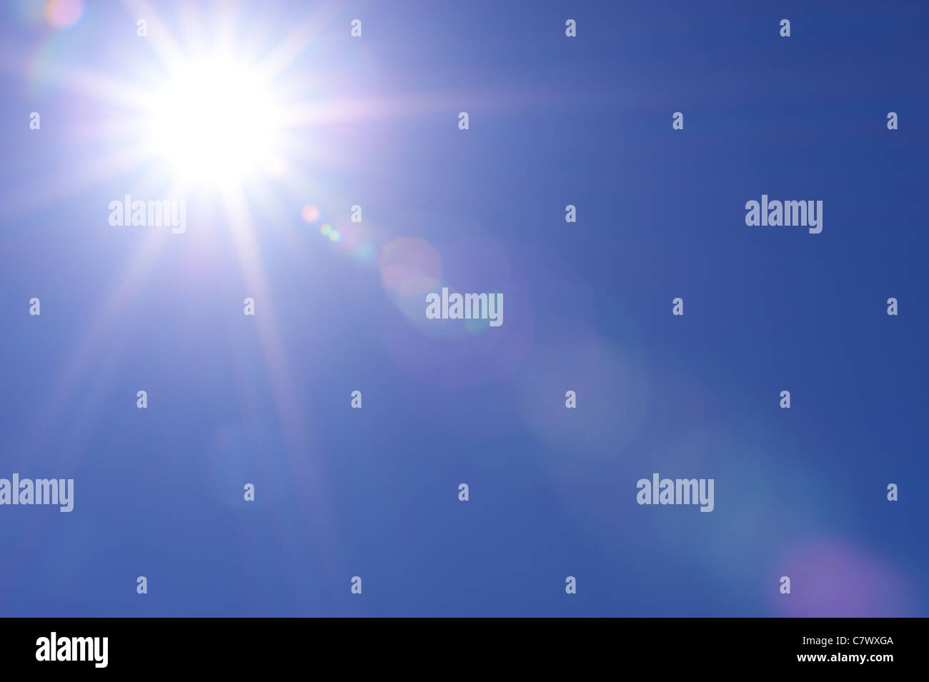 Clear blue sky and sunburst Stock Photo