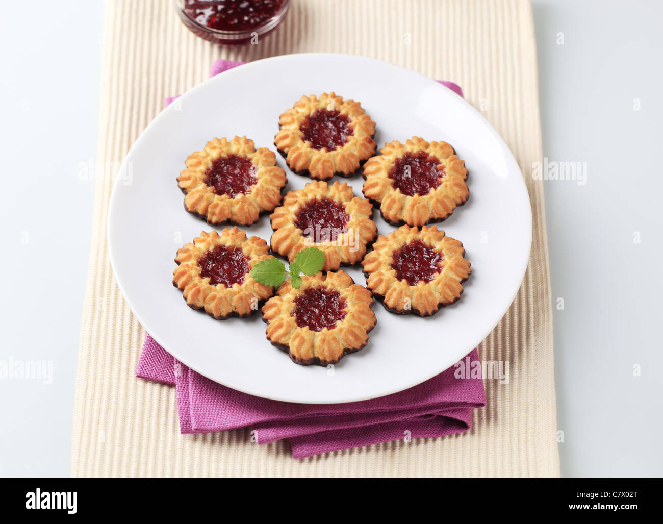 Chocolate dipped butter cookies with jelly center Stock Photo Alamy